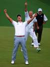 Curtis Compton / The Associated Press
Adam Scott and his caddie Steve Williams show their jubilation as Scott's putt drops into the cup on the second playoff hole Sunday for his Masters victory. Runner-up Angel Cabrera watches in the background.