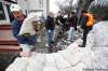 John Woods / the Canadian Press
Volunteers help build sandbag dikes on Scotia Street in April 2009.  Winnipeg's mayor says riverside residents should prepare for flooding, and all Winnipeggers should prepare to volunteer on flood efforts this spring.