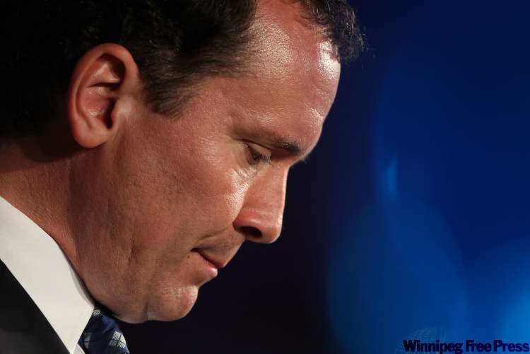 JOE BRYKSA / WINNIPEG FREE PRESS
PC Manitoba leader Hugh McFadyen shows dejection at Canad Inns Polo Park Tuesday night during a pause in his concession speech.