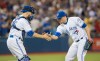 Toronto Blue Jays closer Roberto Osuna, right celebrates with catcher Russell Martin, left, after their team defeated the New York Yankees during MLB baseball action in Toronto, Tuesday May 31, 2016. THE CANADIAN PRESS/Mark Blinch