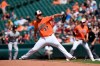 Baltimore Orioles pitcher Dylan Bundy throws against the Boston Red Sox in the first inning of a baseball game Saturday, June 15, 2019, in Baltimore. (AP Photo/Gail Burton)