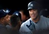 New York Yankees' Aaron Judge, right, smiles in the dugout after his solo home run during the first inning against the Baltimore Orioles in a baseball game Saturday, April 6, 2019, in Baltimore. (AP Photo/Gail Burton)