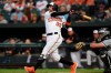 Baltimore Orioles' Renato Nunez follows through on an RBI-double against the Chicago White Sox in the first inning of a baseball game, Wednesday, April 24, 2019, in Baltimore. (AP Photo/Gail Burton)