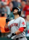 Boston Red Sox's J.D. Martinez points skyward after hitting a solo home run against the Baltimore Orioles in the seventh inning of a baseball game Saturday, June 15, 2019, in Baltimore. (AP Photo/Gail Burton)