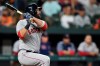 Boston Red Sox's Mitch Moreland watches his three-run home run against the Baltimore Orioles during the fifth inning of a baseball game Tuesday, May 7, 2019, in Baltimore. (AP Photo/Gail Burton)
