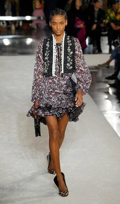 A model wears a creation as part of the Giambattista Valli ready-to-wear Fall-Winter 2019-2020 fashion collection, that was presented in Paris, Monday, March 4, 2019. (AP Photo/Michel Euler)