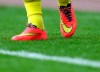 FILE - In this Sept. 13, 2014, photo a view of rainbow laces in Tottenham Hotspurs' Harry Kane boots, as part of an anti-homophobia campaign, as he warms up ahead of their English Premier League soccer match against Sunderland at the Stadium of Light, Sunderland, England. The French football league has set up an action plan to tackle homophobia in its stadiums that paves the way for judicial sanctions against abusive fans. (AP Photo/Scott Heppell)
