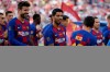 FC Barcelona's Luis Suarez, center, talks with his teammate Lionel Messi, right, prior of the Joan Gamper trophy soccer match between FC Barcelona and Arsenal at the Camp Nou stadium in Barcelona, Spain, Sunday, Aug. 4, 2019. (AP Photo/Joan Monfort)