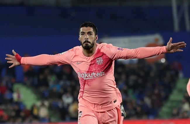 FC Barcelona's Luis Suarez celebrates after scoring during a Spanish La Liga soccer match between Getafe and FC Barcelona at the Alfonso Perez stadium in Getafe, Spain, Sunday, Jan. 6, 2019. (AP Photo/Manu Fernandez)