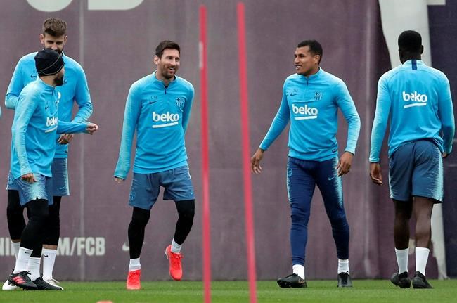 FC Barcelona's Lionel Messi, center left takes part in a training session with teammates at the Sports Center FC Barcelona Joan Gamper in Sant Joan Despi, Spain, Friday, May 24, 2019. FC Barcelona will play against Valencia in the Spanish Copa del Rey soccer match final on Saturday. (AP Photo/Manu Fernandez)