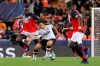Valencia's Lee Kang-in, center, vies for the ball with Lille's Boubakary Soumare, left, during the Champions League group H soccer match between Valencia and Lille at the Mestalla stadium in Valencia, Spain, Tuesday, Nov. 5, 2019. (AP Photo/Alberto Saiz)