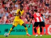 Barcelona's Ousmane Dembele, left, duels for the ball with Athletic Bilbao's Unai Lopez during the Spanish La Liga soccer match between Athletic Bilbao and FC Barcelona at San Mames stadium in Bilbao, northern Spain, Friday, Aug. 16, 2019. (AP Photo/Ion Alcoba Beitia)
