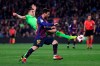FC Barcelona's Lionel Messi, foreground, duels for the ball with Levante's Sergio Postigo during a Spanish Copa del Rey soccer match between FC Barcelona and Levante at the Camp Nou stadium in Barcelona, Spain, Thursday, Jan. 17, 2019. (AP Photo/Manu Fernandez)