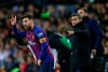 FC Barcelona's Lionel Messi, left, gestures next to his coach Ernesto Valverde during the Spanish La Liga soccer match between FC Barcelona and Valencia at the Camp Nou stadium in Barcelona, Spain, Saturday, Feb. 2, 2019. (AP Photo/Manu Fernandez)