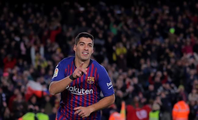 FC Barcelona's Luis Suarez celebrates after scoring during a Spanish Copa del Rey soccer match between FC Barcelona and Sevilla at the Camp Nou stadium in Barcelona, Spain, Wednesday, Jan. 30, 2019. (AP Photo/Manu Fernandez)