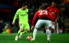 Barcelona's Lionel Messi, left, challenges with Manchester United's Luke Shaw during the Champions League quarterfinal, first leg, soccer match between Manchester United and FC Barcelona at Old Trafford stadium in Manchester, England, Wednesday, April 10, 2019. (AP Photo/Dave Thompson)