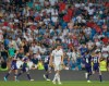 Real Madrid's Gareth Bale reacts as Valladolid's Sergi Guardiola celebrates after scoring his side's first goal during the Spanish La Liga soccer match between Real Madrid and Valladolid at the Santiago Bernabeu stadium in Madrid, Spain, Saturday, Aug. 24, 2019. (AP Photo/Paul White)