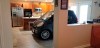 In this Sept. 3, 2019 photo made available by Jessica Eldridge shows her husband's Smart car parked in their kitchen in Jacksonville, Fla. Patrick Eldridge parked his Smart car in his kitchen to protect it from Hurricane Dorian. In a Facebook post, Jessica Eldridge said her husband was 