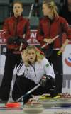 MICHAEL BURNS PHOTO
Winnipeg skip Jennifer Jones, halts her front end as Kristy Jenion, left, and her skip Chelsea Carey stand in the background.