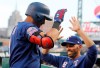 Texas Rangers' Ronald Guzman, left, is greeted by manager Chris Woodward after a solo home run during the sixth inning of the team's baseball game against the Detroit Tigers, Tuesday, June 25, 2019, in Detroit. (AP Photo/Carlos Osorio)