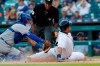 Detroit Tigers' Miguel Cabrera, right, beats the tag of Kansas City Royals catcher Meibrys Viloria, left, to score from second on a single by teammate Dawel Lugo during the first inning of a baseball game, Friday, Aug. 9, 2019, in Detroit. (AP Photo/Carlos Osorio)