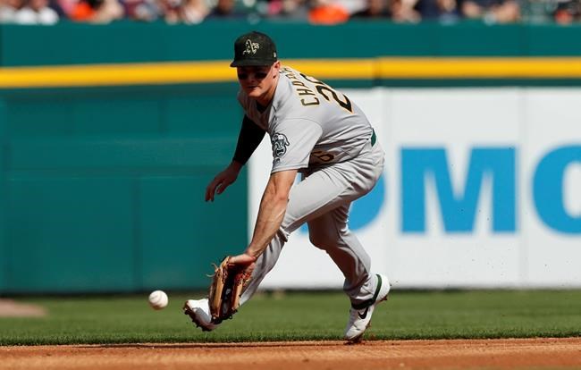 Oakland Athletics third baseman Matt Chapman fields a ground ball for an out hit by Detroit Tigers' Grayson Greiner during the second inning of a baseball game, Saturday, May 18, 2019, in Detroit. (AP Photo/Carlos Osorio)