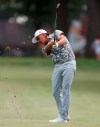 Rickie Fowler hits from the 13th fairway during the third round of the Rocket Mortgage Classic golf tournament, Saturday, June 29, 2019, in Detroit. (AP Photo/Carlos Osorio)