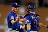 Texas Rangers relief pitcher Shelby Miller and catcher Jeff Mathis shake hands after the Rangers defeating the Detroit Tigers 5-3 in a baseball game, Tuesday, June 25, 2019, in Detroit. (AP Photo/Carlos Osorio)