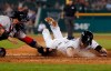 Detroit Tigers' Gordon Beckham beats the tag of Boston Red Sox catcher Sandy Leon to score during the sixth inning of a baseball game Saturday, July 6, 2019, in Detroit. (AP Photo/Carlos Osorio)
