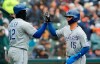 Kansas City Royals' Whit Merrifield (15) scores on a sacrifice fly to left by teammate Alex Gordon during the fifth inning of a baseball game against the Detroit Tigers, Thursday, April 4, 2019, in Detroit. (AP Photo/Carlos Osorio)