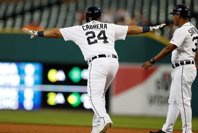 Detroit Tigers' Miguel Cabrera signals safe after the Chicago White Sox right fielder misplayed the ball during the fifth inning of the second game of a baseball doubleheader, Tuesday, Aug. 6, 2019, in Detroit. (AP Photo/Carlos Osorio)