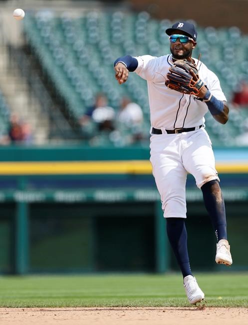 Detroit Tigers second baseman Niko Goodrum throws to first base but is too late to make the out on Chicago White Sox's Leury Garcia during the sixth inning of a baseball game, Wednesday, Aug. 7, 2019, in Detroit. (AP Photo/Duane Burleson)