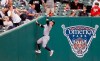 New York Yankees left fielder Clint Frazier climbs up the left field corner to catch a foul fly ball hit by Detroit Tigers' Jake Rogers during the eighth inning of the first game of a baseball doubleheader, Thursday, Sept. 12, 2019, in Detroit. (AP Photo/Duane Burleson)