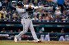 Chicago White Sox's Yoan Moncada hits a two-run triple against the Detroit Tigers during the fifth inning of a baseball game Saturday, Sept. 21, 2019, in Detroit. (AP Photo/Jose Juarez)