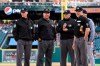 From left to right, umpire Jim Wolf, first base umpire Sam Holbrook, third base umpire Manny Gonzalez and home plate umpire Dan Iassogna wait for batting lineups before a baseball game between the Cleveland Indians and the Detroit Tigers, Friday, June 14, 2019, in Detroit. Wolf was scheduled to be the third base umpire, but left the game in the first inning. (AP Photo/Jose Juarez)