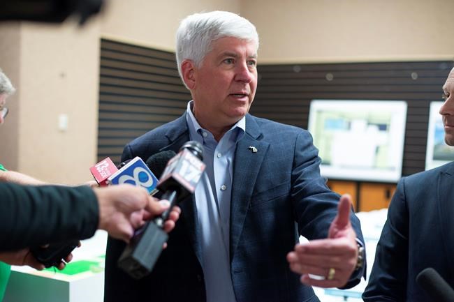 FILE - In this July 24, 2018 file photo, Gov. Rick Snyder answers questions after a press conference in Portage, Mich. Snyder has signed Republican-backed laws to significantly scale back citizen-initiated measures to raise the minimum wage and require paid sick leave for workers. The term-limited Republican governor's move Friday, Dec. 14, 2018, is sure to prompt a lawsuit over an unprecedented strategy adopted by lame-duck lawmakers. (Daniel Vasta/Kalamazoo Gazette via AP File)