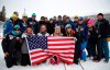 Third placed United States' Lindsey Vonn celebrates with her team in the finish area after the women's downhill race, at the alpine ski World Championships in Are, Sweden, Sunday, Feb. 10, 2019. (AP Photo/Marco Trovati)
