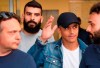 Alexis Sanchez, second from right, waves to fans upon his arrival at the Coni (Italian Olympic Committee) office for medical checks, in Milan, Italy, Wednesday, Aug. 28, 2019. Sanchez will leave Manchester united on a loan deal with the Italian Serie A soccer team, Inter Milan, Italian news agency ANSA said. (Daniel Dal Zennaro/ANSA via AP)