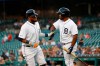 Detroit Tigers' Dawel Lugo, left, celebrates with Christin Stewart after scoring against the Minnesota Twins during the first inning of a baseball game in Detroit, Tuesday, Sept. 24, 2019. (AP Photo/Paul Sancya)