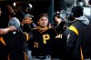 Pittsburgh Pirates' Adam Frazier celebrates scoring on a Colin Moran single in the 10th inning of a baseball game against the Detroit Tigers in Detroit, Wednesday, April 17, 2019. (AP Photo/Paul Sancya)
