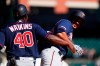 Minnesota Twins' Jonathan Schoop celebrates his two-run home run with first base coach Tommy Watkins (40) in the seventh inning of a baseball game against the Detroit Tigers in Detroit, Thursday, Sept. 26, 2019. (AP Photo/Paul Sancya)
