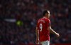 Manchester United's Dimitar Berbatov walks down the pitch during his team's English Premier League soccer match against Swansea at Old Trafford Stadium, Manchester, England, Sunday, May 6, 2012. (AP Photo/Jon Super)