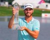 Matthew Wolff holds the trophy after winning the 3M Open golf tournament Sunday, July 7, 2019, in Blaine, Minn. (AP Photo/Andy Clayton- King)