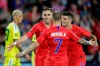 United States' Tyler Boyd, facing camera, celebrates with teammates Paul Arriola (7) and Christian Pulisic (10) as Guyana's Matthew Briggs (20) walks away during the second half of a CONCACAF Gold Cup soccer match Tuesday, June 18, 2019, in St. Paul, Minn. (AP Photo/Andy Clayton-King)