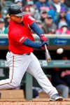 Minnesota Twins' Willians Astudillo hits a ground rule double against the Cleveland Indians in the fourth inning of a baseball game Sunday, March 31, 2019, in Minneapolis. (AP Photo/Bruce Kluckhohn)