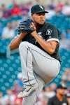 Chicago White Sox starting pitcher Ivan Nova winds up to throw to the Minnesota Twins in the first inning of a baseball game Monday, Aug 19, 2019, in Minneapolis. (AP Photo/Bruce Kluckhohn)