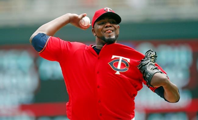 Minnesota Twins pitcher Michael Pineda throws against the Detroit Tigers in the first inning in the first baseball game one of a doubleheader, Saturday, May 11, 2019, in Minneapolis. (AP Photo/Jim Mone)