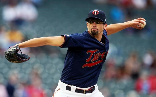 Minnesota Twins pitcher Devin Smeltzer, making his Major League debut, throws against the Milwaukee Brewers in the first inning of a baseball game, Tuesday, May 28, 2019, in Minneapolis. (AP Photo/Jim Mone)