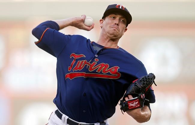 Minnesota Twins pitcher Kyle Gibson throws against the Tampa Bay Rays in the first inning of a baseball game, Tuesday, June 25, 2019, in Minneapolis. (AP Photo/Jim Mone)