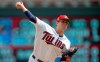 Minnesota Twins pitcher Kyle Gibson throws against the Texas Rangers in the first inning of a baseball game Sunday, July 7, 2019, in Minneapolis. (AP Photo/Jim Mone)